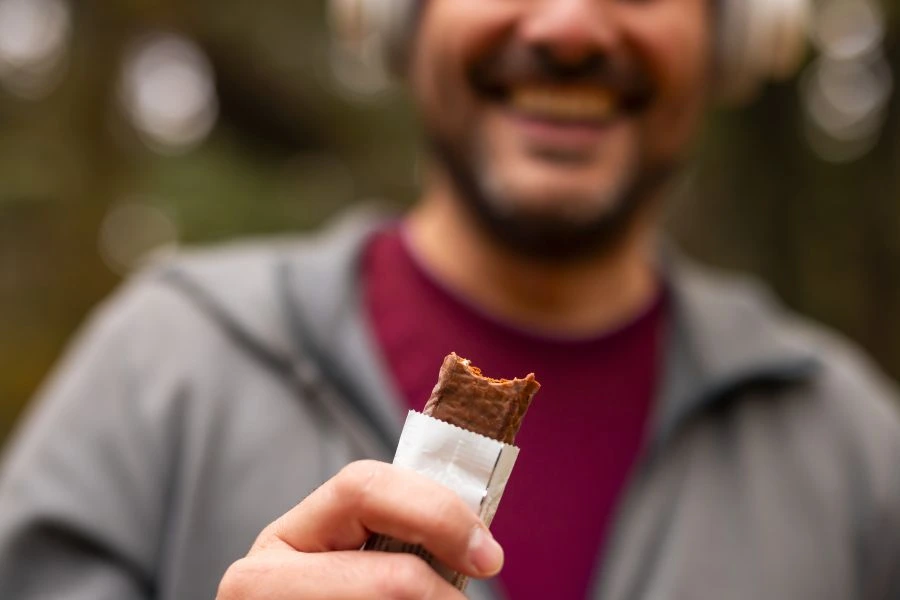 Man eating nutrition bar